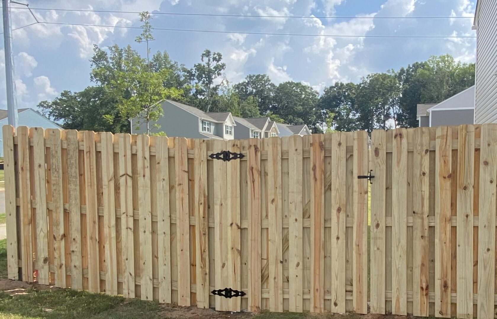 A wooden fence with a sky background