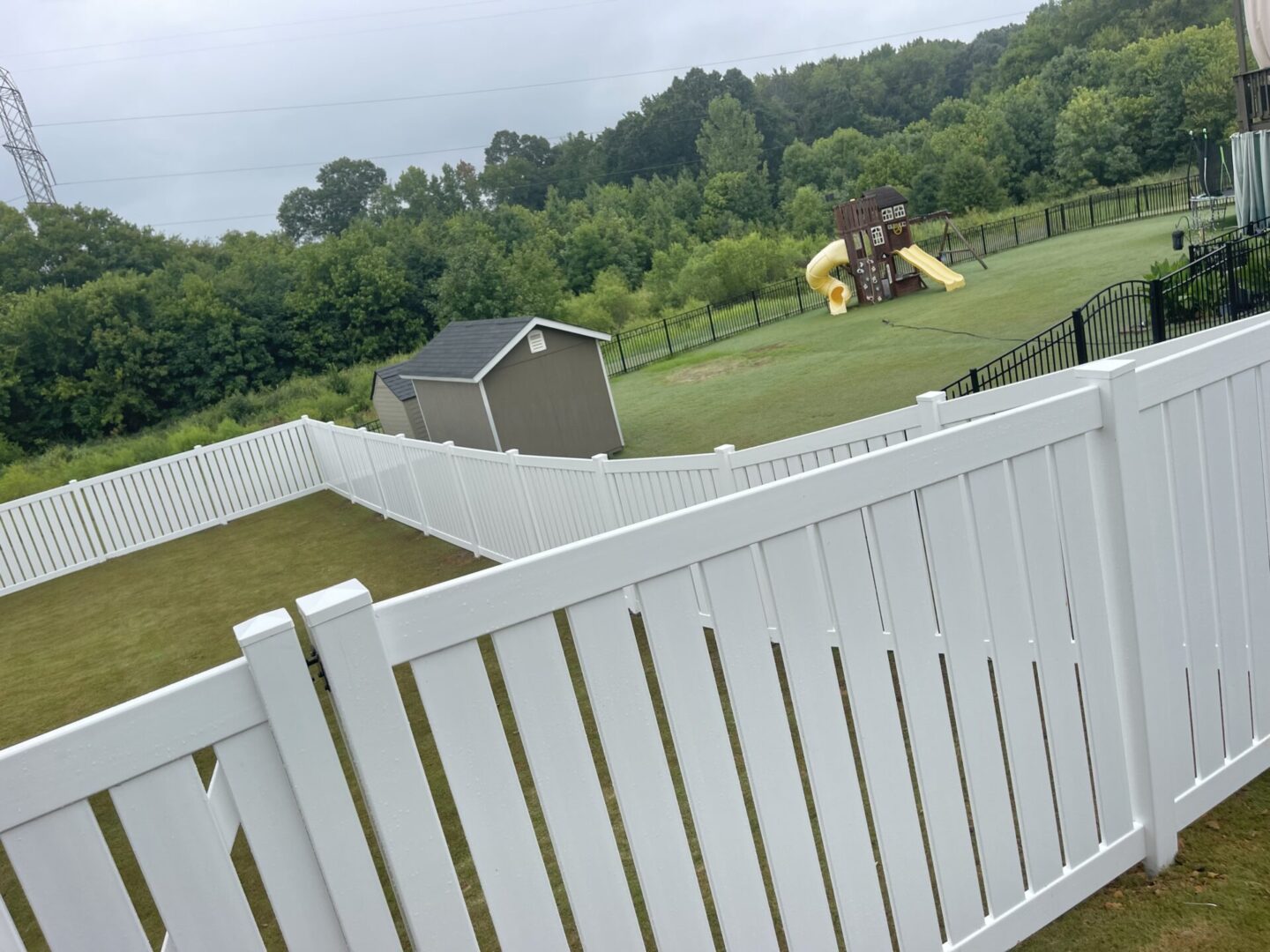 A view of a backyard from the back yard.