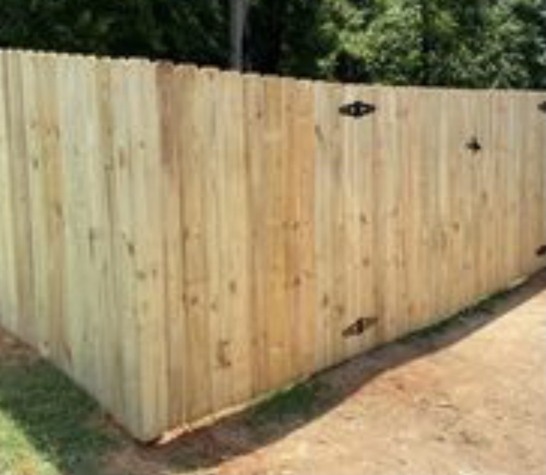 A wooden fence with two padding on each side.